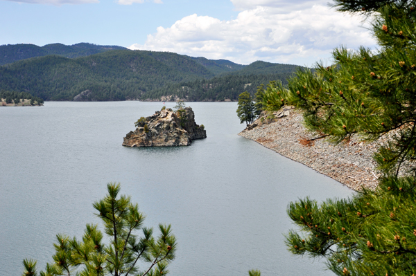 a flag on the island at Pactola Lake